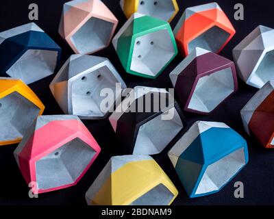 Cactus pot. Concrete pot. Empty colorful pentagon concrete planters on dark background. Stock Photo
