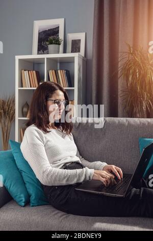 Adult woman working from home Stock Photo