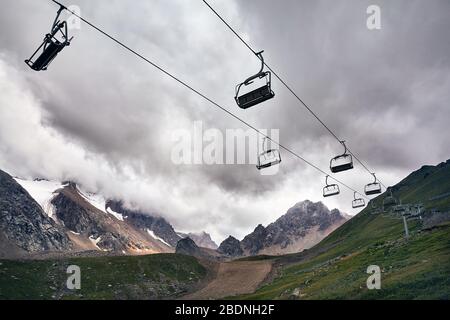 Cable car station at the mountain ski resort at grey cloudy sky Cable car station at the mountain ski resort at grey cloudy sky