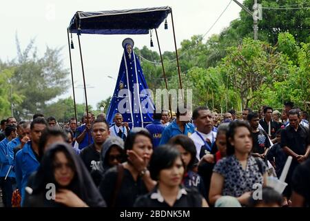 Tuan Ma (Mother Mary) statue is brought to Larantuka Cathedral during Semana Santa (Holy Week) procession on Good Friday in Larantuka, Indonesia. Stock Photo