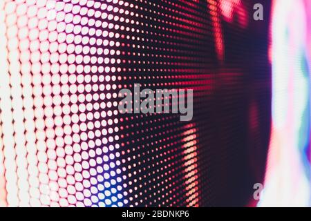 Bright colored blue LED wall with pink pattern - close up background Stock Photo