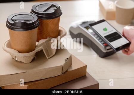 Two coffee cups and boxes of pizza Stock Photo