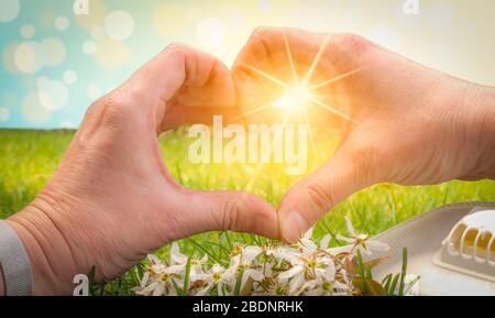 Heart shaped female hands. Thank you concept for doctors, nurses and medical staff. Stock Photo