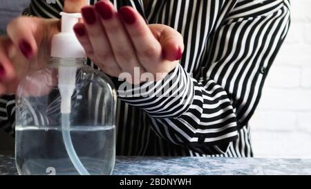 Washing hands with gel alcohol based hand sanitizer Stock Photo - Alamy