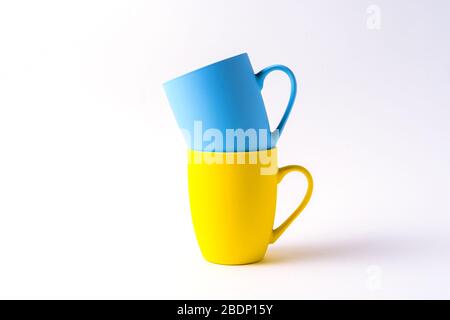 Stack with mugs isolated on white background, front view. Stock Photo