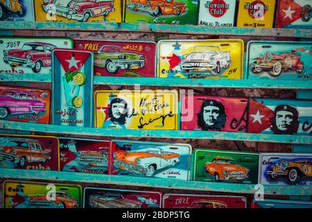 TRINIDAD, CUBA - DECEMBER 10, 2019: Traditional handcrafted vehicle registration plates like souvenirs for sale in Trinidad, Cuba. Stock Photo