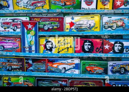 TRINIDAD, CUBA - DECEMBER 10, 2019: Traditional handcrafted vehicle registration plates like souvenirs for sale in Trinidad, Cuba. Stock Photo