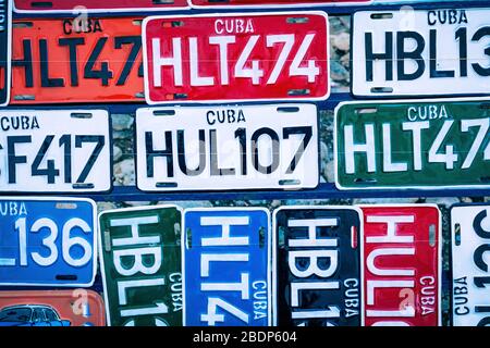 TRINIDAD, CUBA - DECEMBER 10, 2019: Traditional handcrafted vehicle registration plates like souvenirs for sale in Trinidad, Cuba. Stock Photo