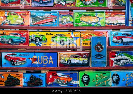 TRINIDAD, CUBA - DECEMBER 10, 2019: Traditional handcrafted vehicle registration plates like souvenirs for sale in Trinidad, Cuba. Stock Photo