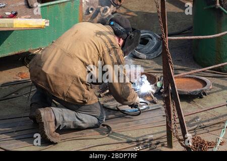 The work of the welder in the factory. Stock Photo