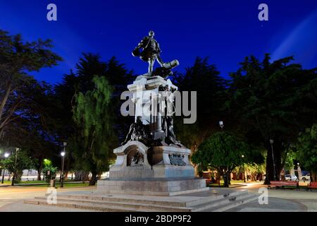 Memorial to Ferdinand Magellan at night, Plaza Armas, Punta Arenas city, Patagonia, Chile, South America Stock Photo