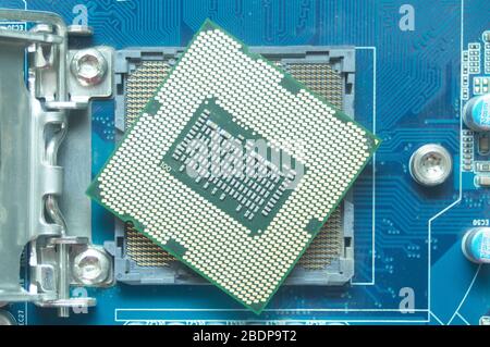 Central processor unit (CPU) and his socket on motherboard. Technical, electricity and IT concept Stock Photo