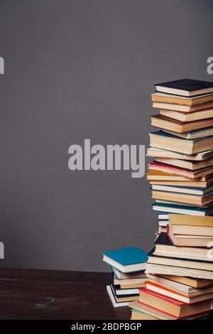 a lot of different educational books on a gray background Stock Photo