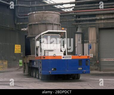 1991, heavy vehicles moving Crucibles at Sheffield Steel works,, South Yorkshire, Northern England, UK Stock Photo