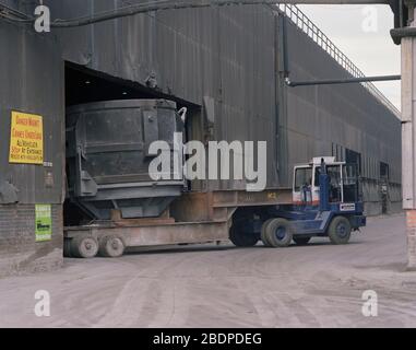 1991, heavy vehicles moving Crucibles at Sheffield Steel works,, South Yorkshire, Northern England, UK Stock Photo