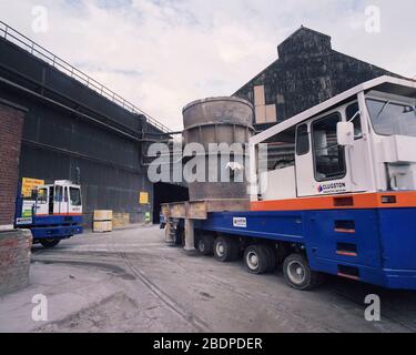 1991, heavy vehicles moving Crucibles at Sheffield Steel works,, South Yorkshire, Northern England, UK Stock Photo