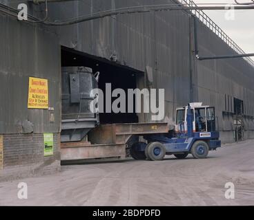 1991, heavy vehicles moving Crucibles at Sheffield Steel works,, South Yorkshire, Northern England, UK Stock Photo