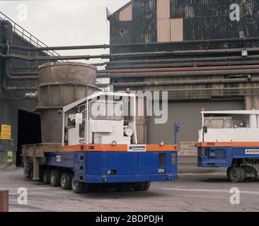 1991, heavy vehicles moving Crucibles at Sheffield Steel works,, South Yorkshire, Northern England, UK Stock Photo