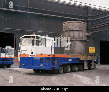 1991, heavy vehicles moving Crucibles at Sheffield Steel works,, South Yorkshire, Northern England, UK Stock Photo