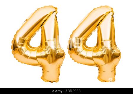 Number 44 forty four made of golden inflatable balloons isolated on white. Helium balloons, gold foil numbers. Party decoration, anniversary sign for Stock Photo