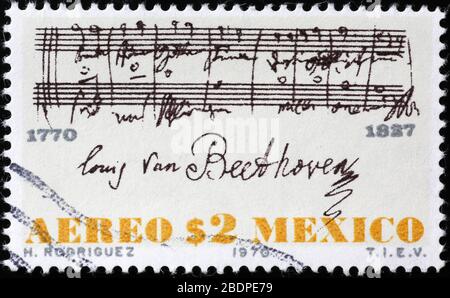 Sheet music signed by Beethoven on postage stamp Stock Photo