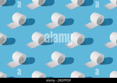 Rolls of soft toilet paper on blue. Isometric. Increased potential. High unexpected demand. Seamless pattern. Stock Photo