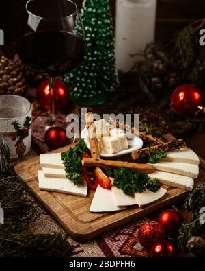 cheese plate with various cheese and crackers Stock Photo