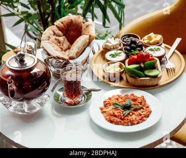 fried eggs with tomato and other food for breakfast Stock Photo