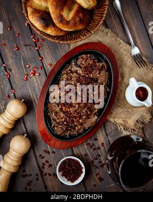 fried meat slices with pomegranate Stock Photo