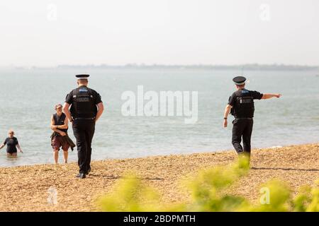 Southend-on-Sea, UK. 9th Apr, 2020. Police officers advise the member of the public near the seafront path at Chalkwell train station. The seafront footpath, which links Chalkwell train station to Old Leigh-on-Sea, has been closed by Southend Borough Council for the Easter Weekend. The popular seafront path is narrow and so a decision has been made to close it. The council is taking a number of measures to make people stay away from the seafront. Penelope Barritt/Alamy Live News Stock Photo