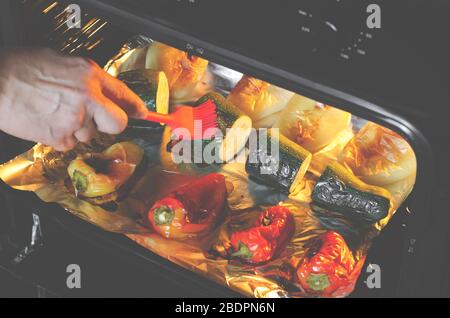Healthy food. Pepper and zucchini with a ruddy crust are prepared in the oven. Grilled vegetables Stock Photo