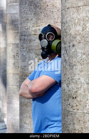 Cologne, Deutschland. 07th Apr, 2020. A Kolner poses with a makeshift mask from GDR stock at the main station. Koln, April 7th, 2020 | usage worldwide Credit: dpa/Alamy Live News Stock Photo