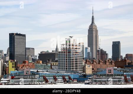 Midtown Manhattan viewed over icy Hudson River in New York City, United States of America Stock Photo