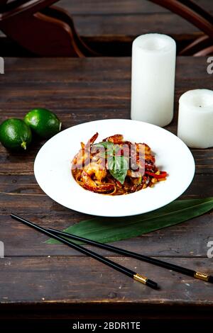 fried shrimps in mixed salad and lime Stock Photo