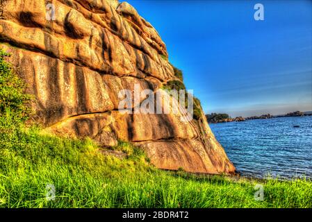 Village of Plouhmanac’h, France. Artistic view of the Plouhmanac’h, coastline viewed from the Sentier des Douaniers. Stock Photo