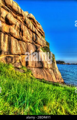 Village of Plouhmanac’h, France. Artistic view of the Plouhmanac’h, coastline viewed from the Sentier des Douaniers. Stock Photo