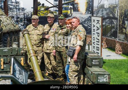 Dnipro, Ukraine - May 25, 2016: Combatant soldiers, volunteers and officers, Ukrainian veterans on the opening day of museum Russian-Ukrainian war in Stock Photo