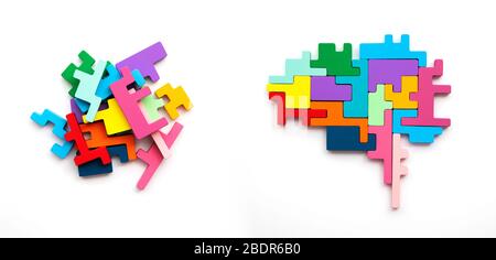 Right and left sides of the brain concept. Puzzle pieces in the shape of a brain Stock Photo