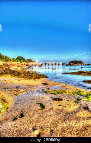 Village of Plouhmanac’h, France. Artistic view of Ploumanac'h’s Plage Saint-Guirec. Stock Photo