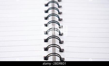 Close up top view of  lines notebook or spiral notepad paper background. Stock Photo