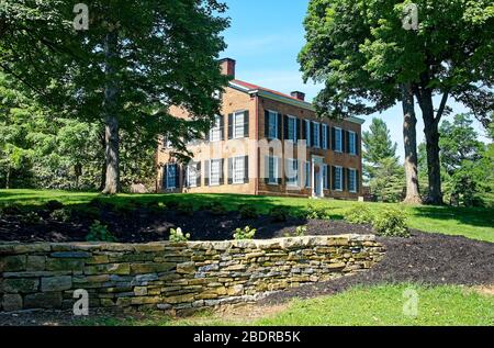 Federal Hill Mansion, 1818, red brick building, many windows, black shutters, stone wall, estate, inspired Stephen Foster's song, My Old Kentucky Home Stock Photo