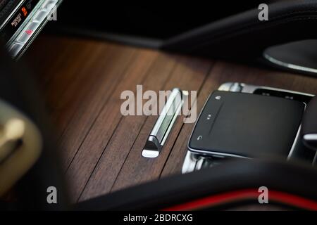 Touch control panel for multimedia system in a modern car. Stock Photo