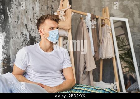 Concentrated brunette male being deep in thoughts Stock Photo