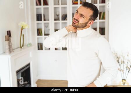 Dispirited bearded male looking into the distance Stock Photo