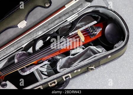 Electric violin in a case Stock Photo