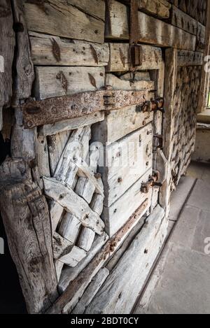 Chepstow castle has on display the oldest surviving castle doors in Europe. Made from green oak in around 1190AD Stock Photo