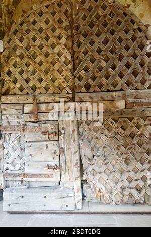 Chepstow castle has on display the oldest surviving castle doors in Europe. Made from green oak in around 1190AD Stock Photo