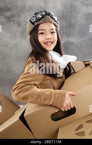 Paper airplane driving happy children Stock Photo