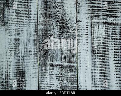 The texture of the wooden planks. The background is black and white with a bluish tinge. Stock Photo
