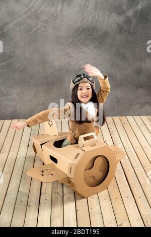 Paper airplane driving happy children Stock Photo